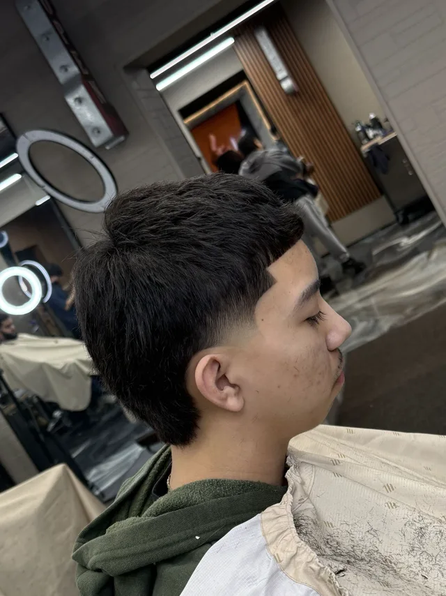Textured crop with a hard part, cut at BR Barber Lounge