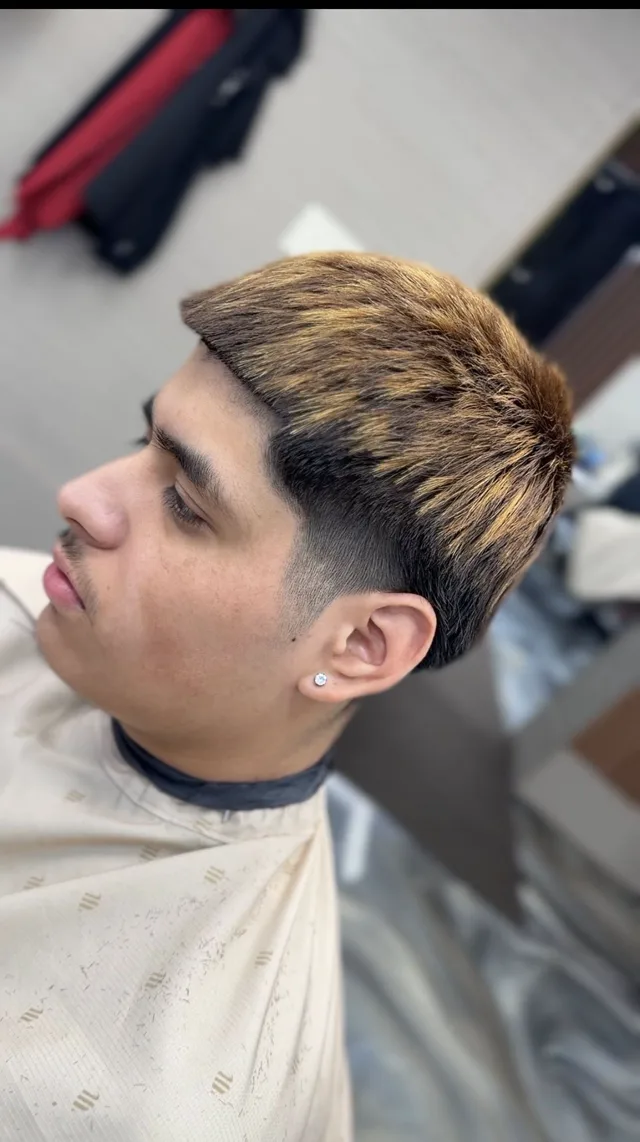 High fade with a sharp line-up, cut at BR Barber Lounge